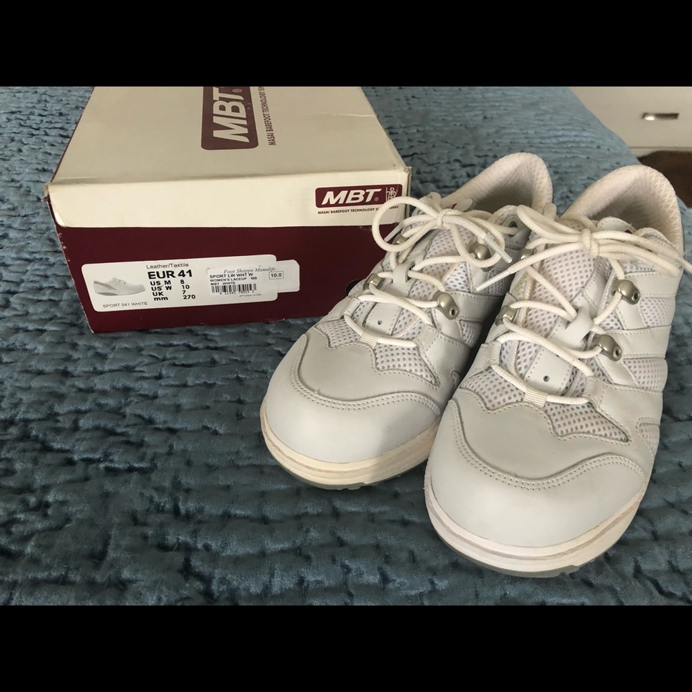 Never worn MBT’s . Slight cosmetic defect on side of heel. Like new condition